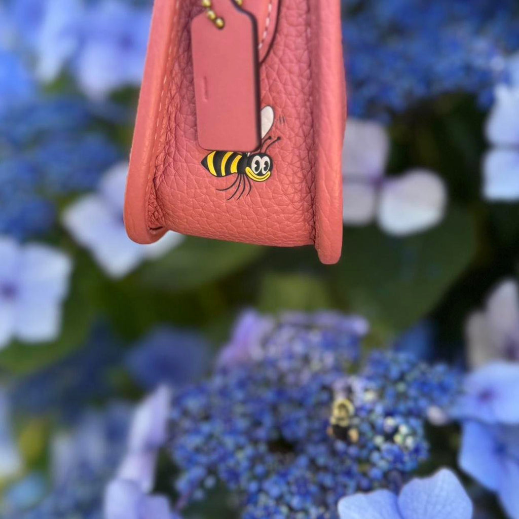 Coach x Disney Swinger 20 leather Mickey Mouse flowers burnt coral CH464